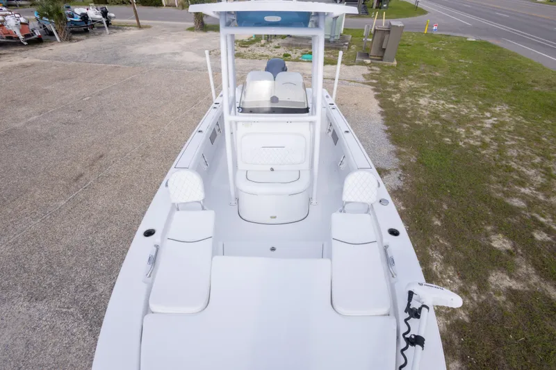 Slide: The Image of 2023 Sportsman Masters 227 Bay Boat with spacious deck and seating, parked outdoors. - 35
