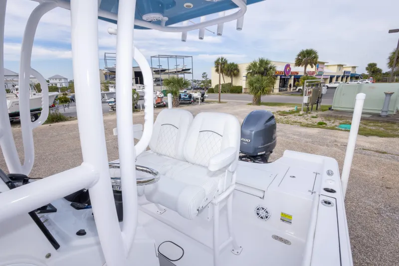 Slide: The Image of 2023 Sportsman Masters 227 Bay Boat with white seating and Yamaha outboard motor. - 42
