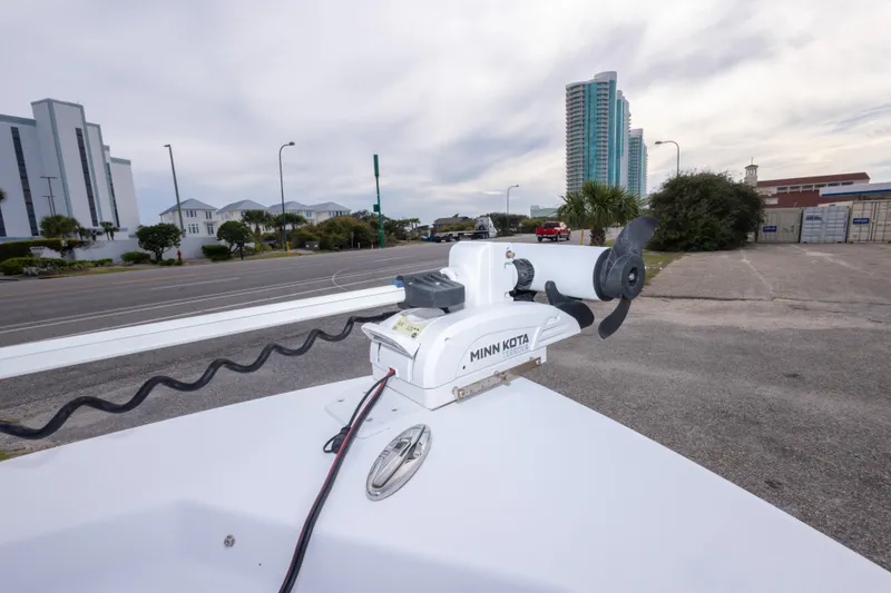 Slide: The Image of 2023 Sportsman Masters 227 Bay Boat with Minn Kota Terrova motor in urban setting. - 45