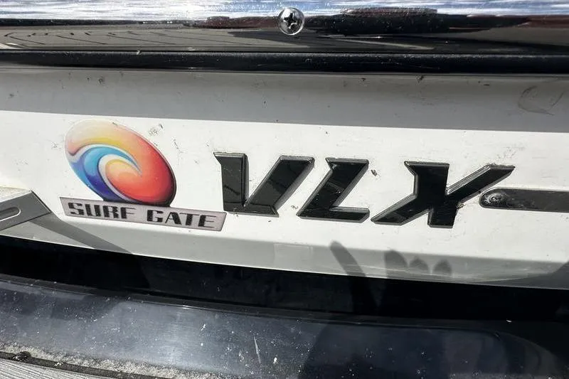 Slide: The Image of 2018 Malibu Wakesetter 21 VLX with Surf Gate logo on the hull. - 11