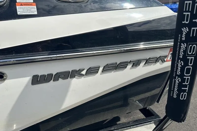 Slide: The Image of 2018 Malibu Wakesetter 21 VLX boat, close-up of logo and branding details. - 13