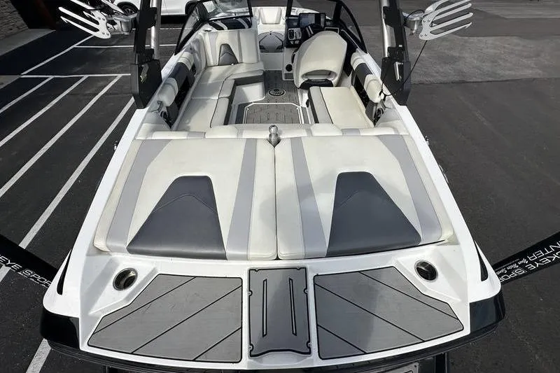 Slide: The Image of 2018 Malibu Wakesetter 21 VLX boat interior with sleek seating and modern design. - 16