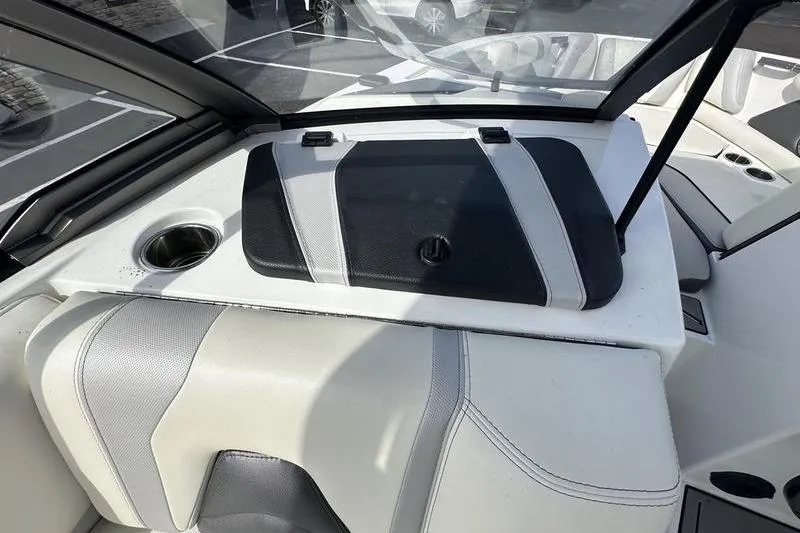 Slide: The Image of 2018 Malibu Wakesetter 21 VLX interior with sleek seating and cup holder. - 21