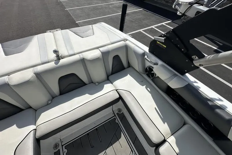 Slide: The Image of 2018 Malibu Wakesetter 21 VLX interior with white seating and sleek design. - 26