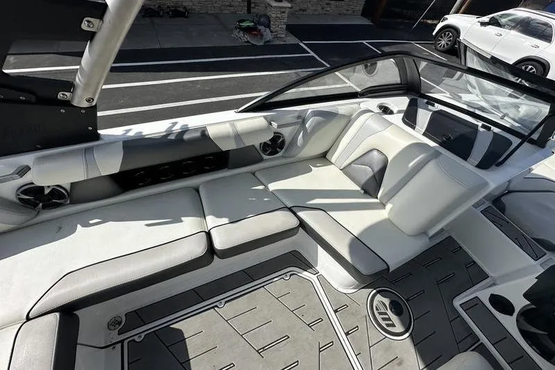 Slide: The Image of 2018 Malibu Wakesetter 21 VLX interior with sleek white seating and modern design. - 28