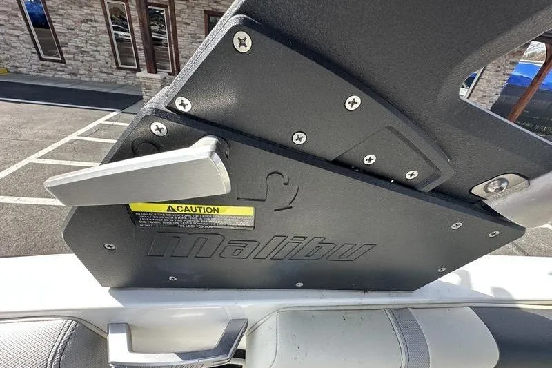 Slide: The Image of 2018 Malibu Wakesetter 21 VLX boat detail with caution label and logo. - 36