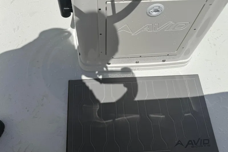 Slide: The Image of 2026 Avid 19 FSX boat deck with logo and shadow detail. - 12