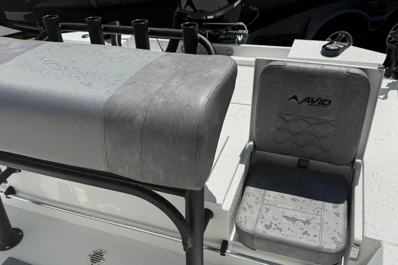 Slide: The Image of Avid 19 FSX 2026 boat seats with water droplets, showcasing modern design. - 13