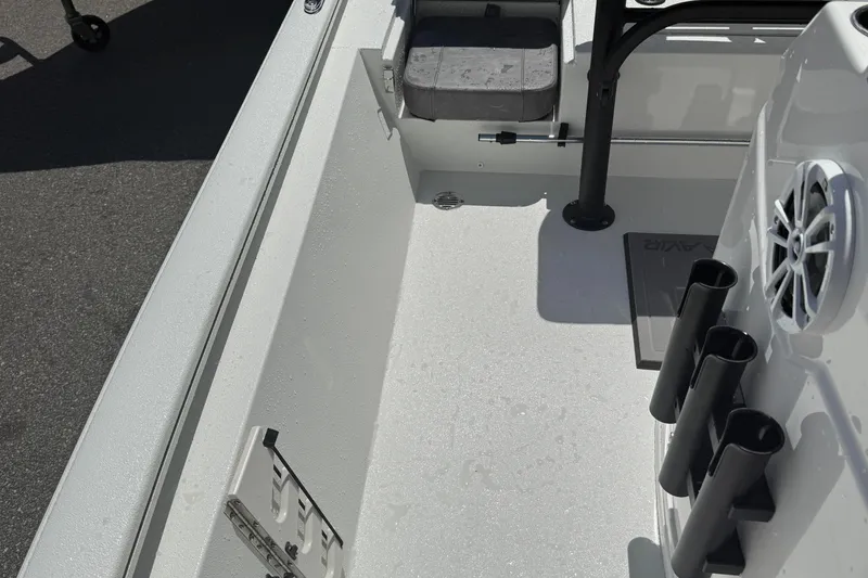 Slide: The Image of Interior of 2026 Avid 19 FSX boat with rod holders and seating. - 14