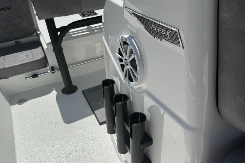 Slide: The Image of 2026 Avid 19 FSX boat interior with speaker and rod holders. - 16