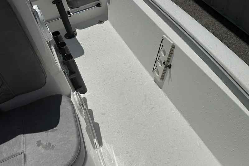 Slide: The Image of Interior of 2026 Avid 19 FSX boat showing seating and rod holders. - 17