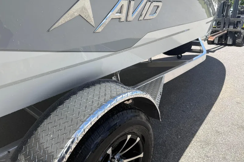 Slide: The Image of 2026 Avid 19 FSX boat on trailer, showcasing sleek design and metallic finish. - 3