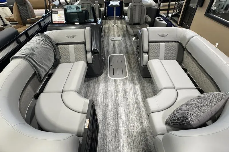 Slide: The Image of 2026 Bennington 24 M Quad Bench interior with luxurious seating and modern design. - 10