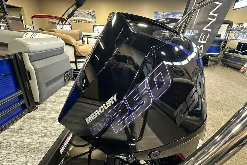 Slide: The Image of 2026 Bennington 24 M Quad Bench with Mercury Pro 250 engine in showroom. - 11