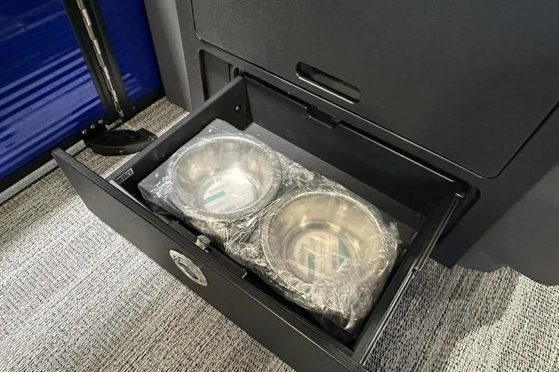 Slide: The Image of Drawer with two metal bowls in a 2026 Bennington 24 M Quad Bench. - 20