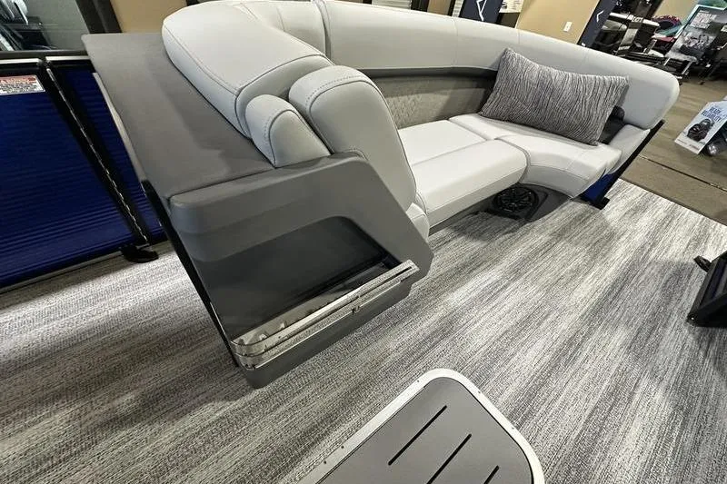 Slide: The Image of 2026 Bennington 24 M Quad Bench with sleek gray seating and modern design. - 22