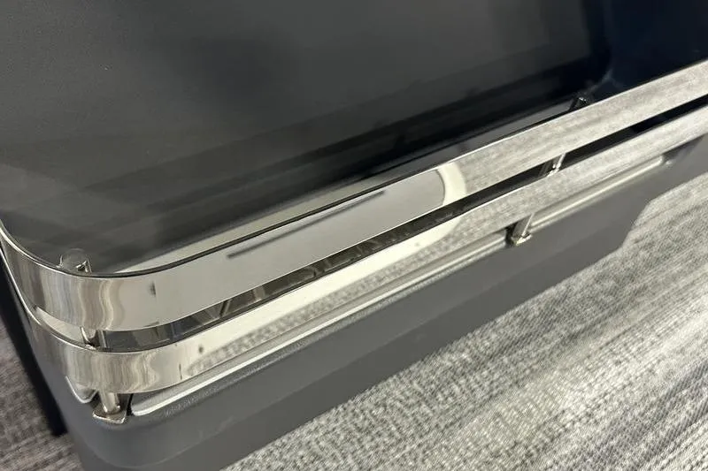 Slide: The Image of Close-up of 2026 Bennington 24 M Quad Bench with sleek metal railing design. - 25