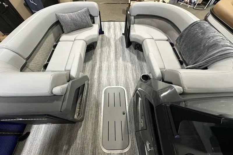 Slide: The Image of 2026 Bennington 24 M Quad Bench interior with plush seating and modern design. - 27