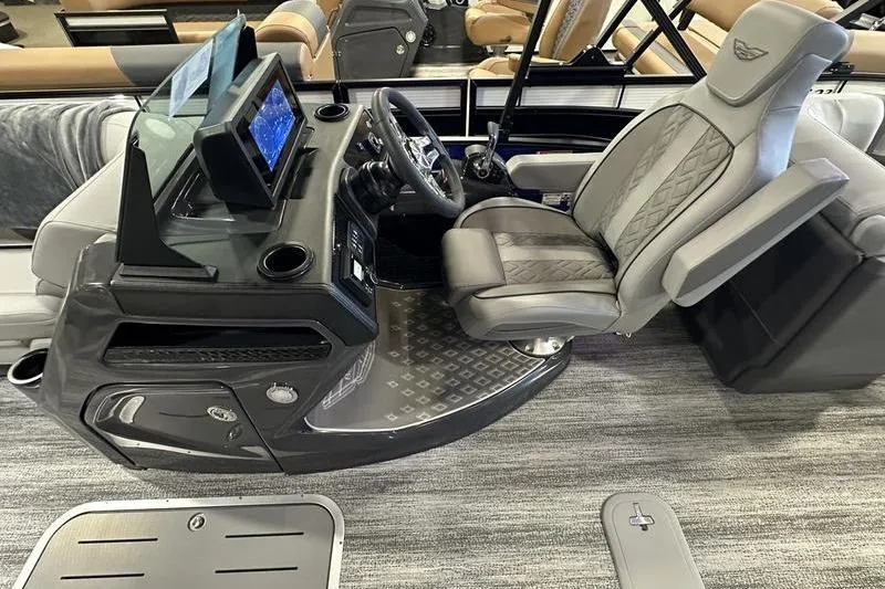 Slide: The Image of 2026 Bennington 24 M Quad Bench boat interior with modern helm and seating. - 28