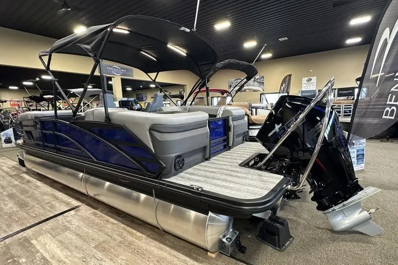 Slide: The Image of 2026 Bennington 24 M Quad Bench pontoon boat displayed indoors. - 6