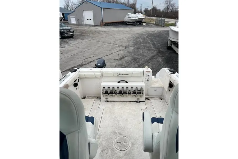 Slide: The Image of 2004 Seaswirl Striper 2601 Walkaround I/O boat interior with seating and storage. - 10