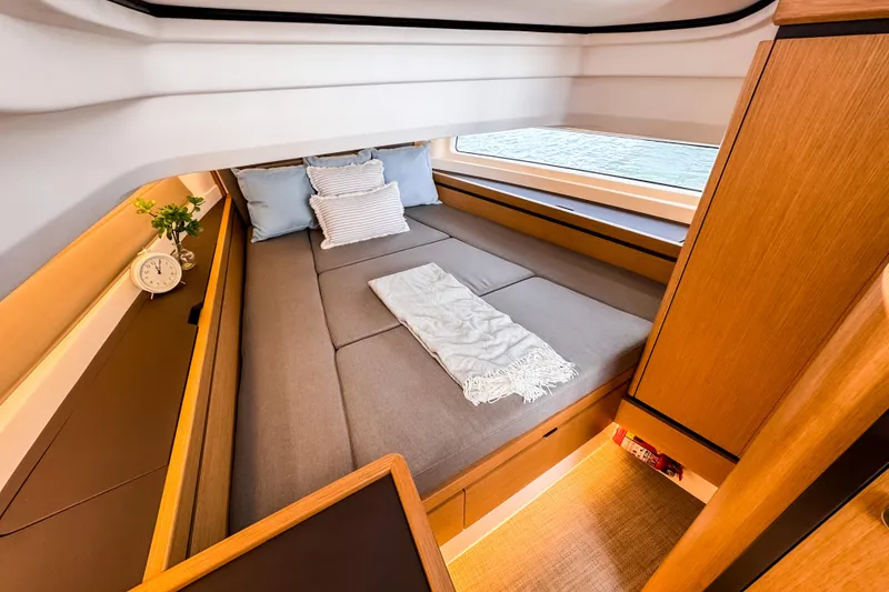 Slide: The Image of Luxurious cabin interior of 2025 Aiata Wayfinder 38 Open yacht, featuring cozy bedding and elegant design. - 18