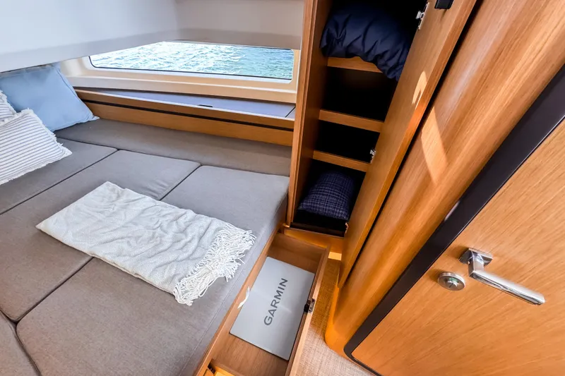Slide: The Image of Cozy cabin interior of 2025 Aiata Wayfinder 38 Open yacht with wooden storage. - 19