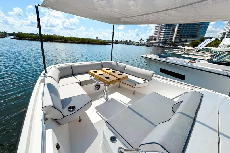 Slide: The Image of Luxurious 2025 Aiata Wayfinder 38 Open yacht with elegant seating and scenic waterfront view. - 23