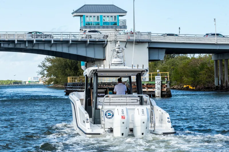 Slide: The Image of Aiata Wayfinder 38 Open 2026 under bridge on water. - 4