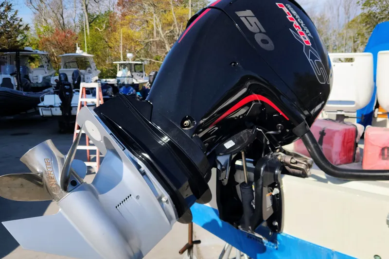 Slide: The Image of 1978 Boston Whaler Outrage 20 with a powerful 150 HP outboard motor. - 23