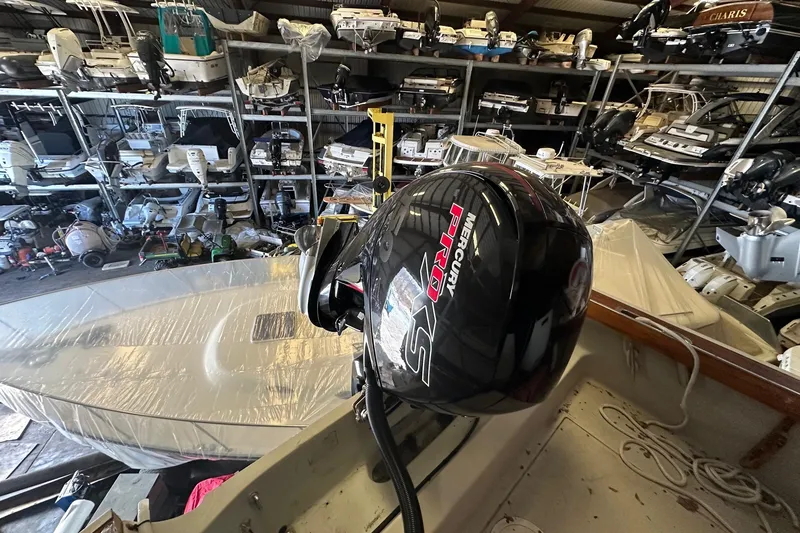 Slide: The Image of 1978 Boston Whaler Outrage 20 with Mercury Pro XS engine in storage facility. - 3