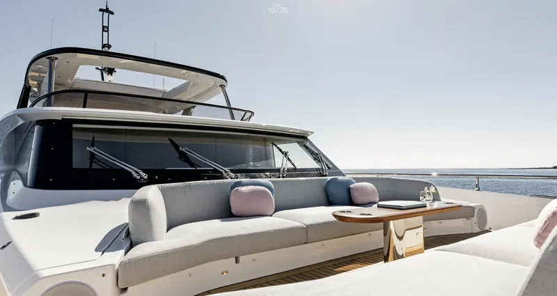 Slide: The Image of Luxury Azimut Grande 26M yacht deck with elegant seating, 2025 model. - 11