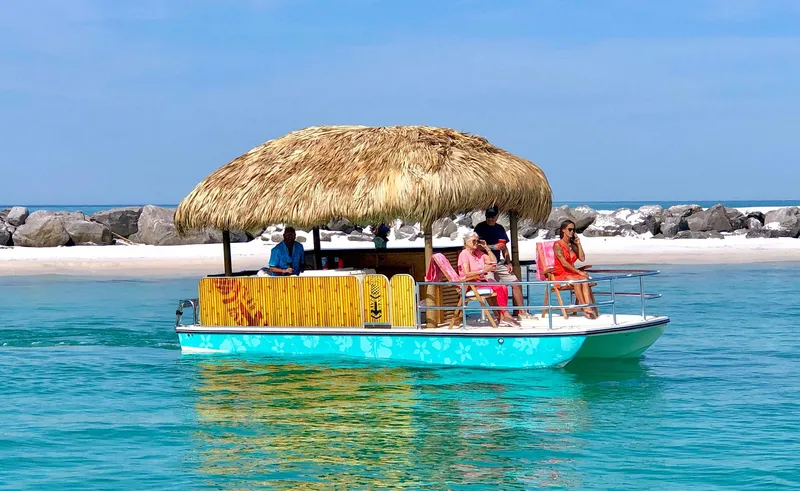 The Image of 2023 Beachcat 23 Catamaran with tiki hut, cruising on turquoise waters near a sandy beach. - 1