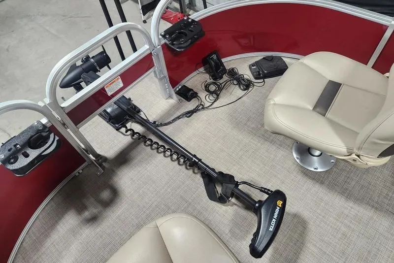 Slide: The Image of 2025 Sun Tracker Bass Buggy 16 XL Select interior with seating and trolling motor. - 3