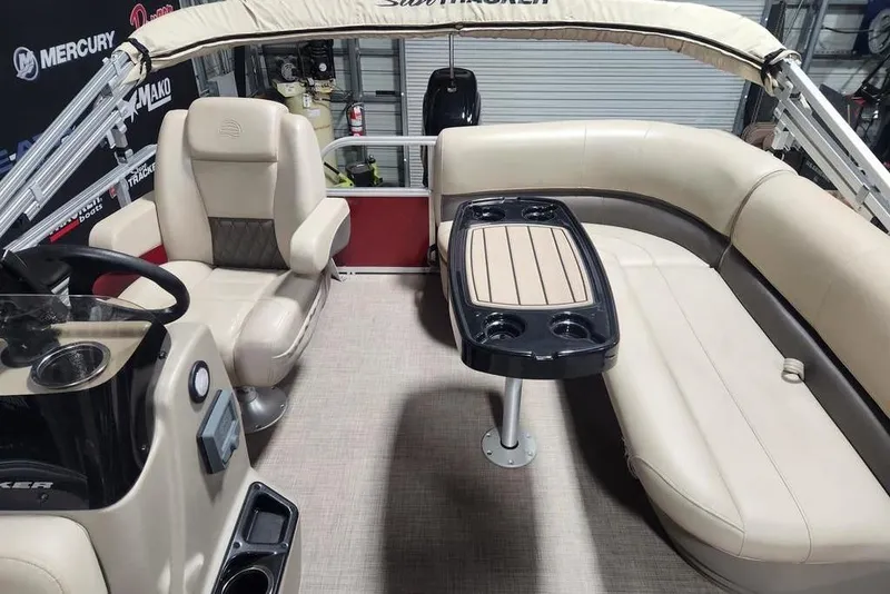 Slide: The Image of 2025 Sun Tracker Bass Buggy 16 XL Select interior with seating and table. - 4
