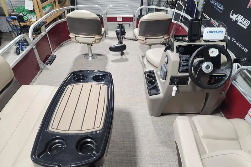 Slide: The Image of 2025 Sun Tracker Bass Buggy 16 XL Select interior with steering console and seating. - 6