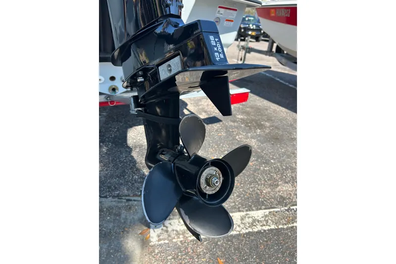 Slide: The Image of 2025 Mako Pro Skiff 13 CC boat propeller in a parking lot. - 5