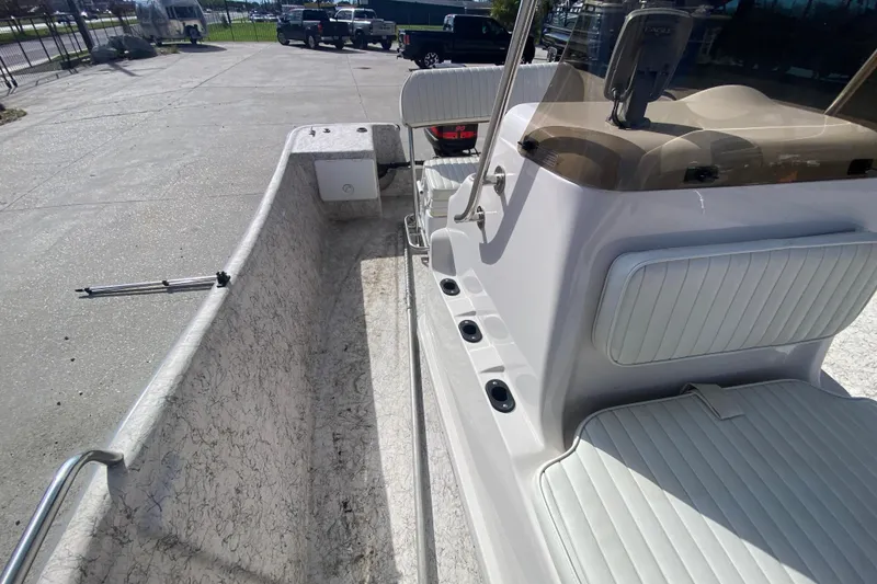 Slide: The Image of 2001 Fishmaster 17 boat interior with seating and control console. - 19