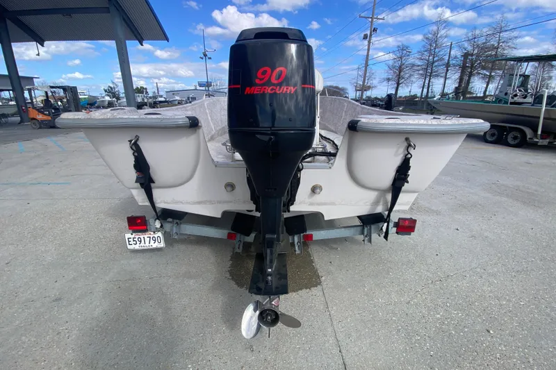 Slide: The Image of Rear view of a 2001 Fishmaster 17 boat with Mercury 90 engine. - 5