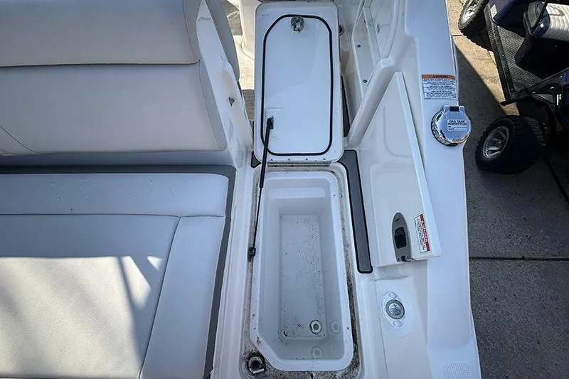 Slide: The Image of Open storage compartment on a 2021 Sea Ray SDX 270 Outboard boat. - 14