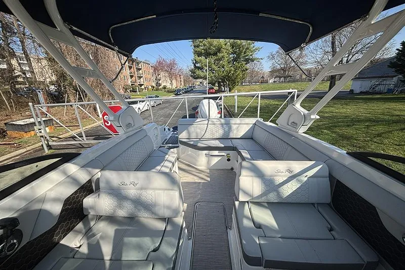 Slide: The Image of Interior view of 2021 Sea Ray SDX 270 Outboard boat with spacious seating. - 18