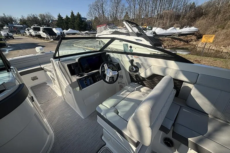 Slide: The Image of 2021 Sea Ray SDX 270 Outboard boat interior with modern helm and seating. - 19