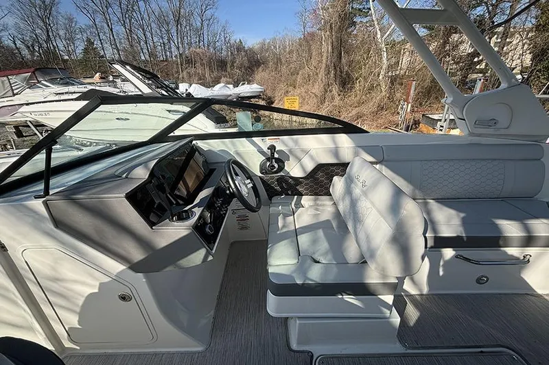 Slide: The Image of 2021 Sea Ray SDX 270 Outboard boat interior with helm and seating area. - 20