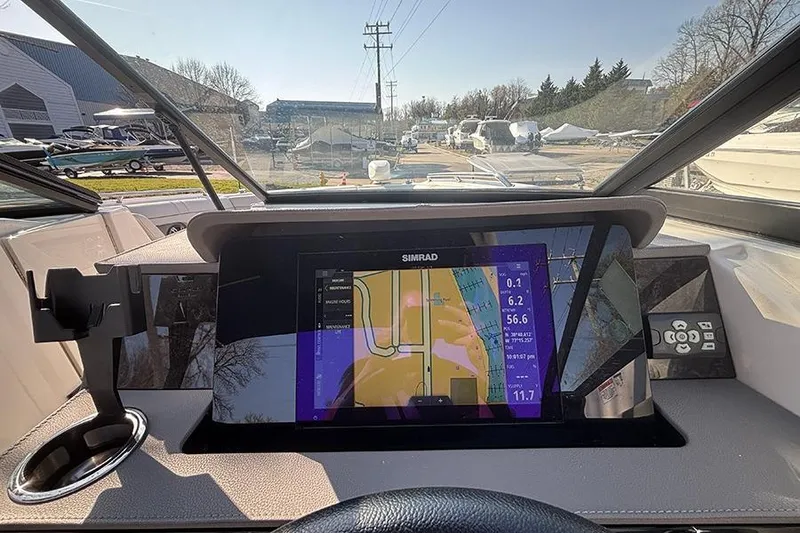 Slide: The Image of Dashboard of 2021 Sea Ray SDX 270 Outboard with Simrad navigation display. - 22