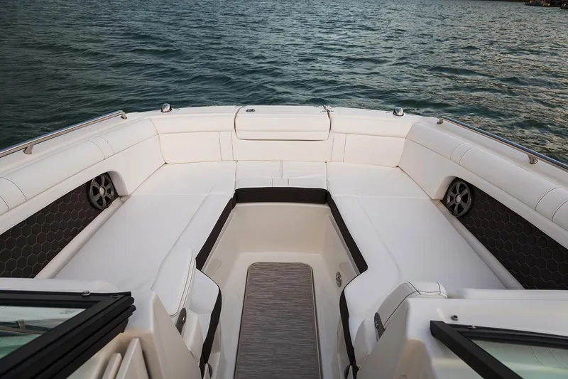 Slide: The Image of 2021 Sea Ray SDX 270 Outboard boat on trailer under sunny sky. - 3