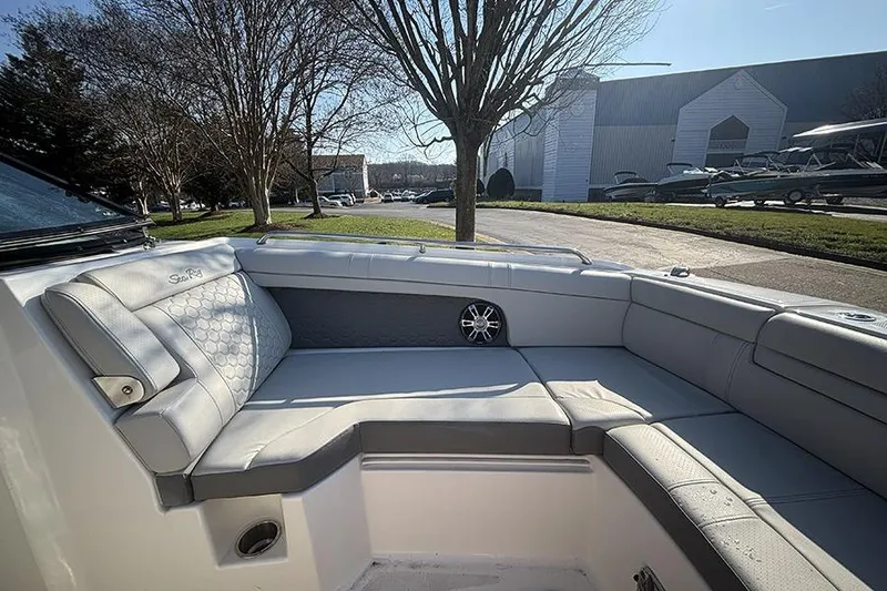 Slide: The Image of 2021 Sea Ray SDX 270 Outboard boat interior with luxurious seating and speaker. - 30