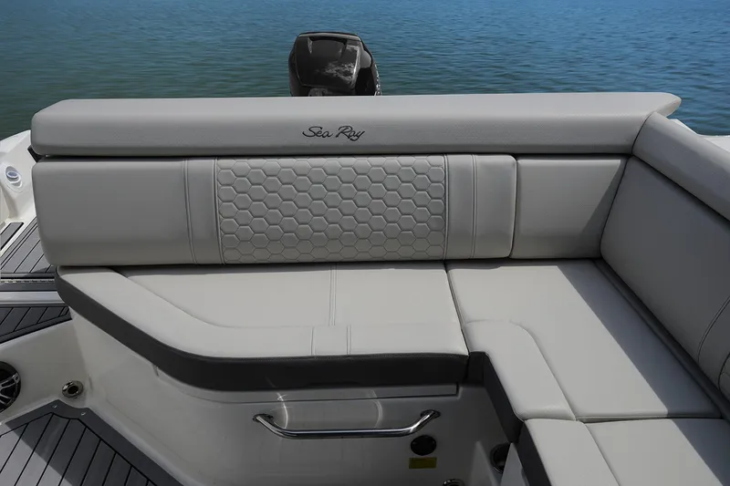 Slide: The Image of 2021 Sea Ray SDX 270 Outboard boat interior with spacious seating and elegant design. - 9