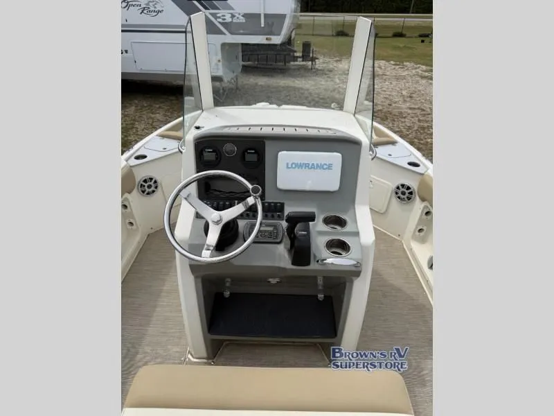 Slide: The Image of Interior view of a 2018 Stingray 206 boat with steering console. - 7