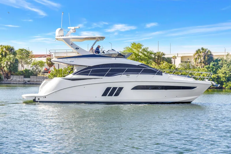 The Image of 2016 Sea Ray 510 Fly yacht cruising on a sunny day. - 0