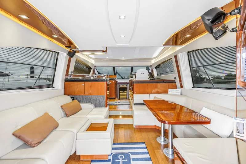 Slide: The Image of Luxurious interior of 2016 Sea Ray 510 Fly yacht with elegant seating and dining area. - 11